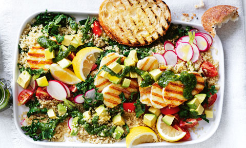 Haloumi and Quinoa Salad garnished with lemon, radish and pesto. Served with chargrilled bread.