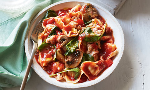 Mushroom, Sausage and Spinach Tortellini in a rich tomato sauce, served in a dinner bowl