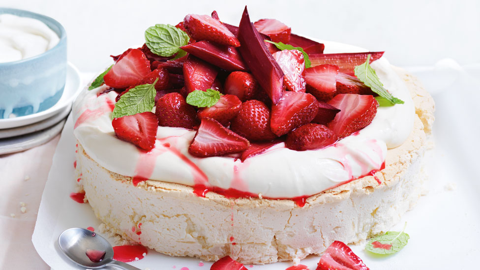 Pavlova with Yoghurt, Rhubarb and Strawberry on baking paper