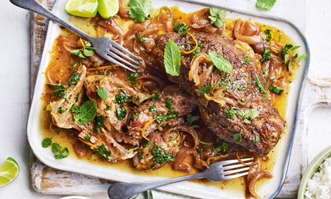 Slow Roasted Cuban Mojo Pork on serving plate, dressed with Mint leaves