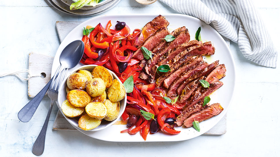 Garlic and oregano steak with olive peperonata and baby potatoes