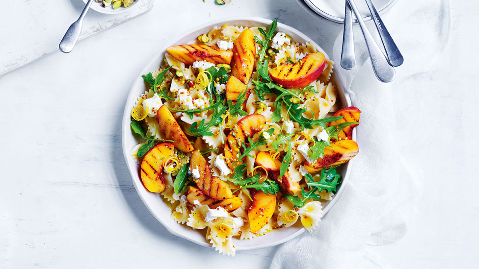 Pasta salad with grilled peach fetta and rocket leaves