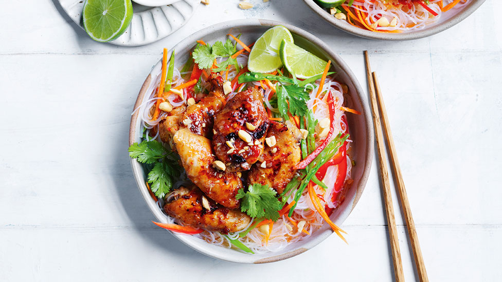 Noodle salad with sweet chilli, lemongrass chicken and lime wedges