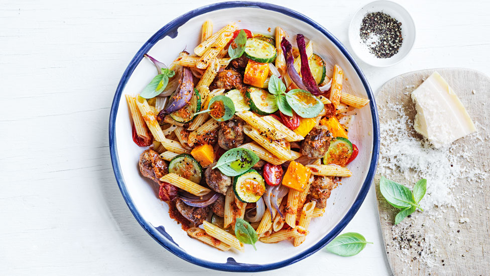 A bowl of vegetable and lamb sausage pasta
