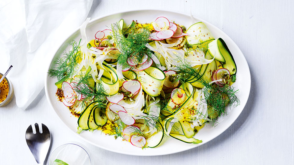 Crunchy pickled vegetable salad with dressing on a large plate