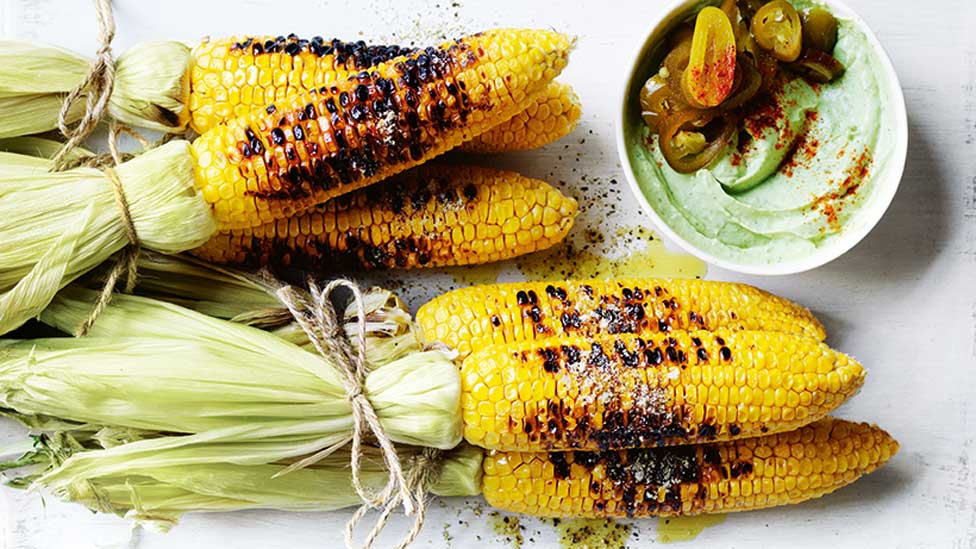 Six grilled corn with pickled jalapeño and avocado aioli