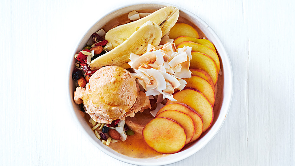 A peach and coconut vegan ice cream bowl