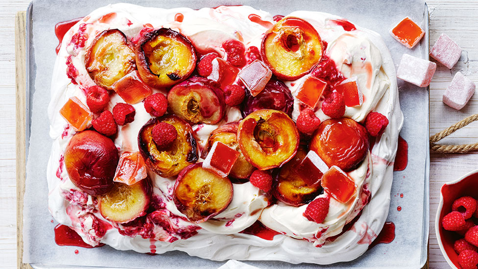 Roasted peach and raspberry slab pavlova