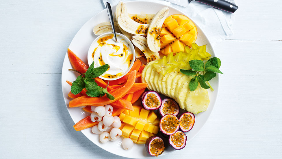 Tropical fruit platter on a white table