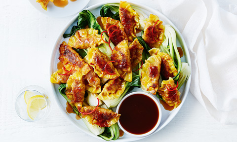 Pork gyoza with Asian-style greens