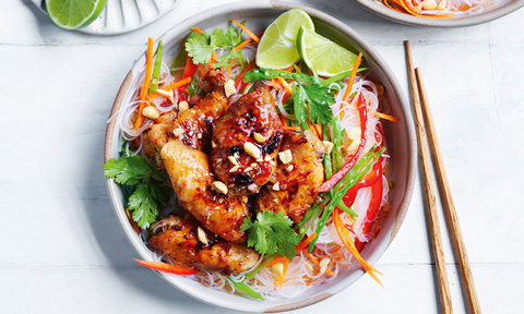 Noodle salad with sweet chilli, lemongrass chicken and lime wedges
