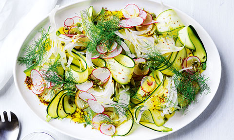 Crunchy pickled vegetable salad with dressing on a large plate