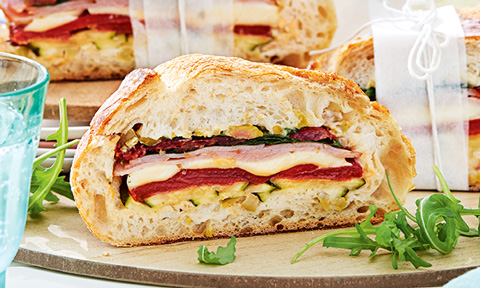 An open bocconcini sandwich with veggies and ham