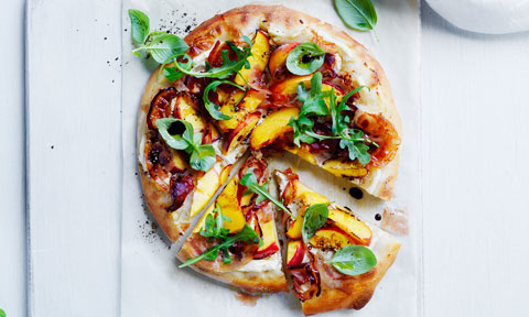 nectarine, ricotta and pancetta pizza on baking paper