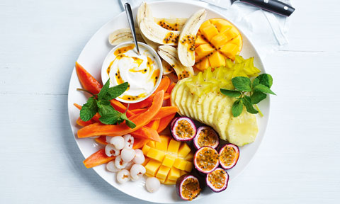 Tropical fruit platter on a white table