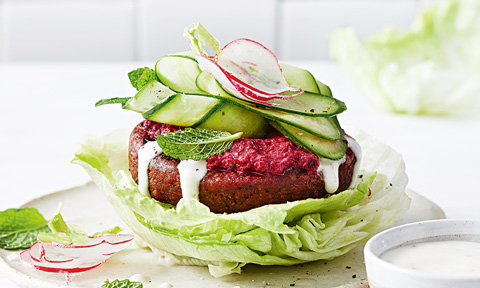 Vegan burger in lettuce bun and cucumber ribbons