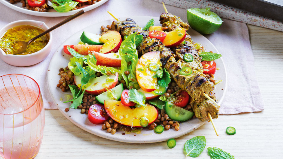 Curried lamb skewers with nectarine and lentil salad