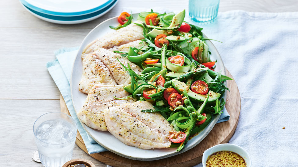 Pan fried fish with avocado and asparagus salad
