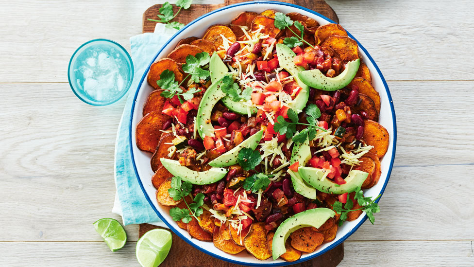 Vegan sweet potato nachos with beans and avocado