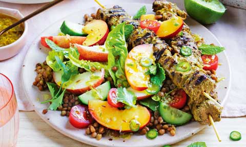 Curried lamb skewers with nectarine and lentil salad