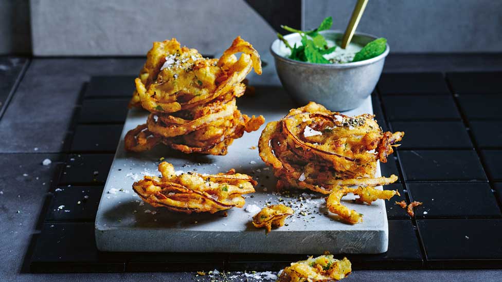 Curtis Stone’s onion bhajis with lime yoghurt dipping sauce