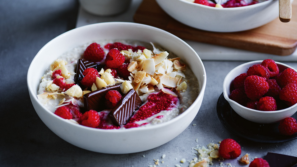 Porridge topped with raspberry, chocolate and coconut