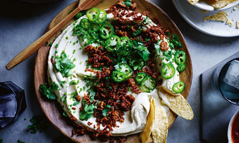 Hommus topped with pork mince and spring onions