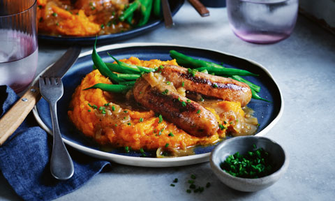 Curtis Stone’s bangers and pumpkin mash with caramelised onion gravy