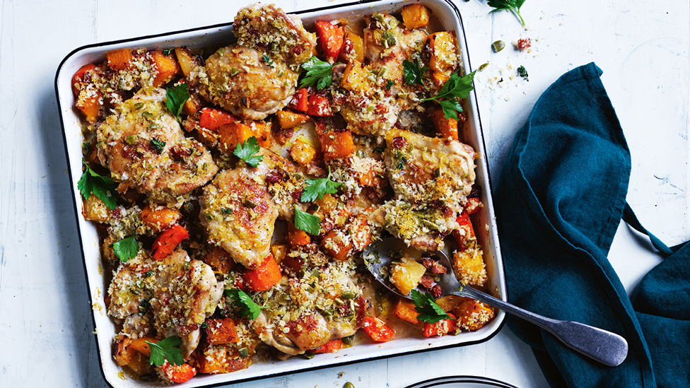 A baked chicken dish with pumpkin and chorizo