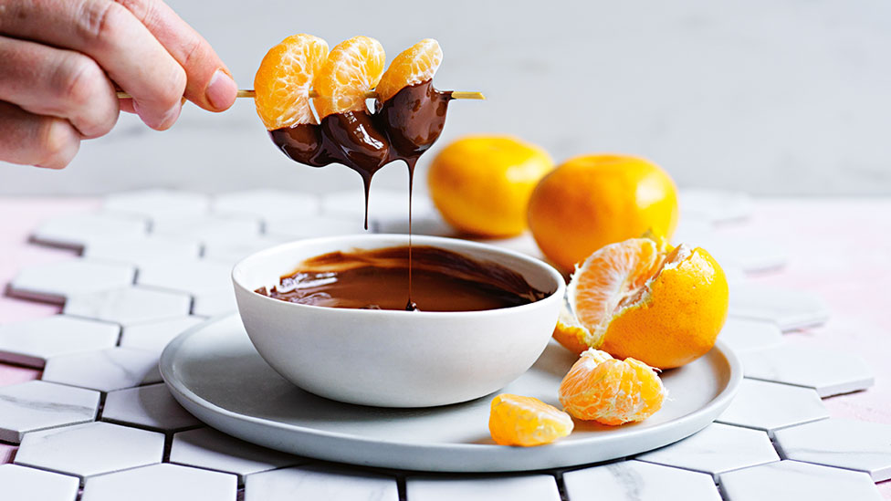 Mandarin segments with choc fondue