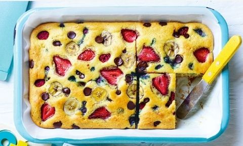Choc, berry and banana pancake served in a baking dish with baked berries on top
