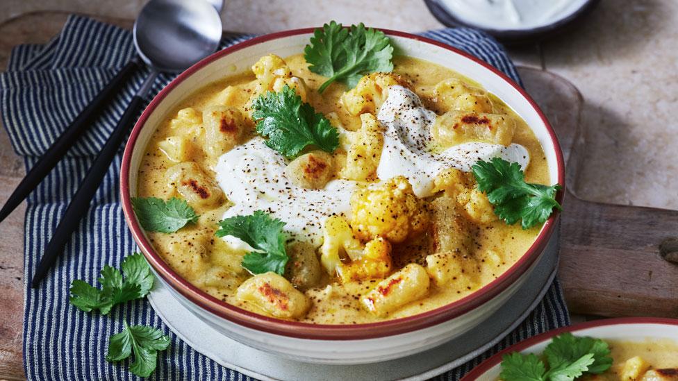 Creamy pumpkin soup with yoghurt and gnocchi