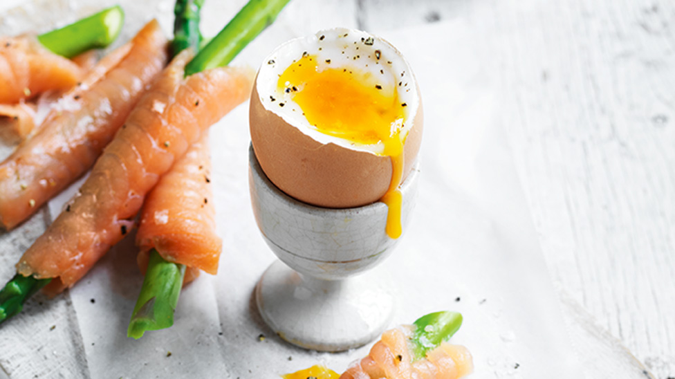 A half boiled egg with salmon