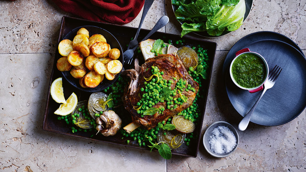 Slow-roasted lamb shoulder with crushed peas, roasted potatoes and mint salsa