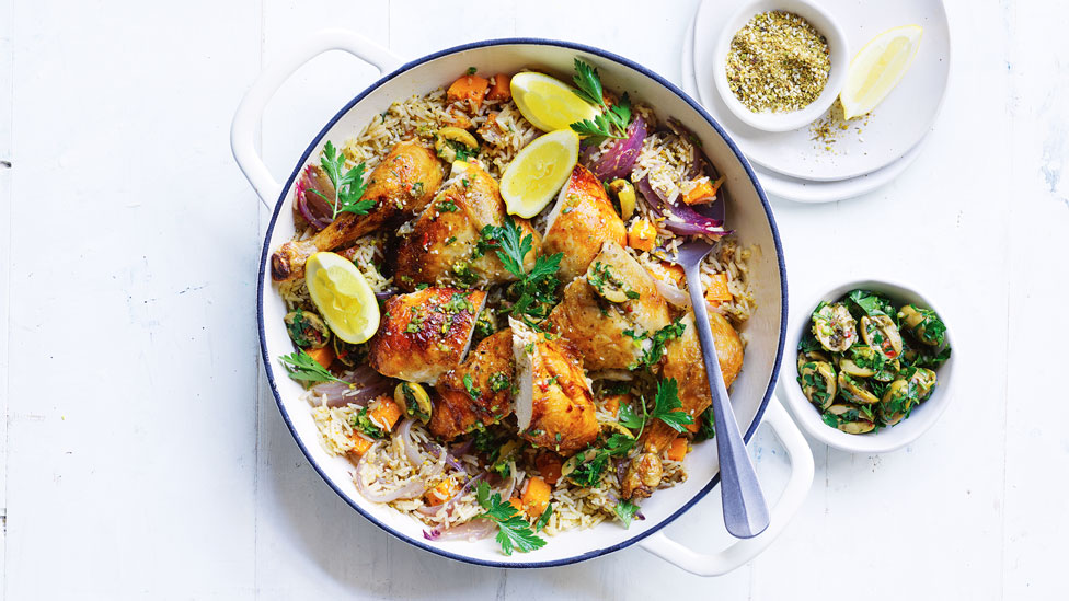 Easy pilaf with pumpkin, chicken, dukkah and lemon wedges