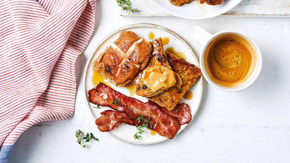 Three hot cross bun French toasts with maple bacon