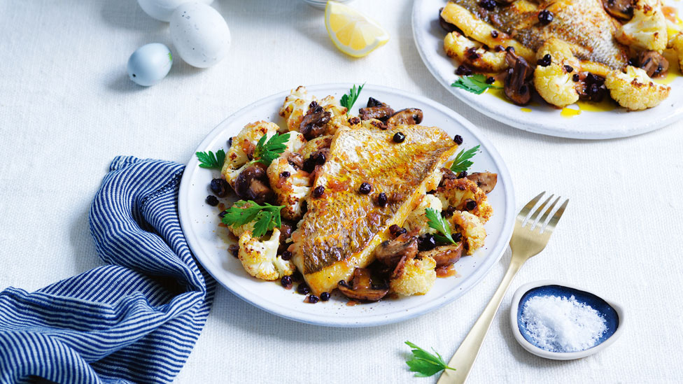 Pan-roasted snapper with cauliflower & mushrooms in a dish