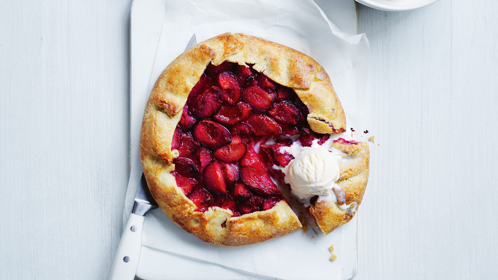 A pastry crosaa with plum and cream