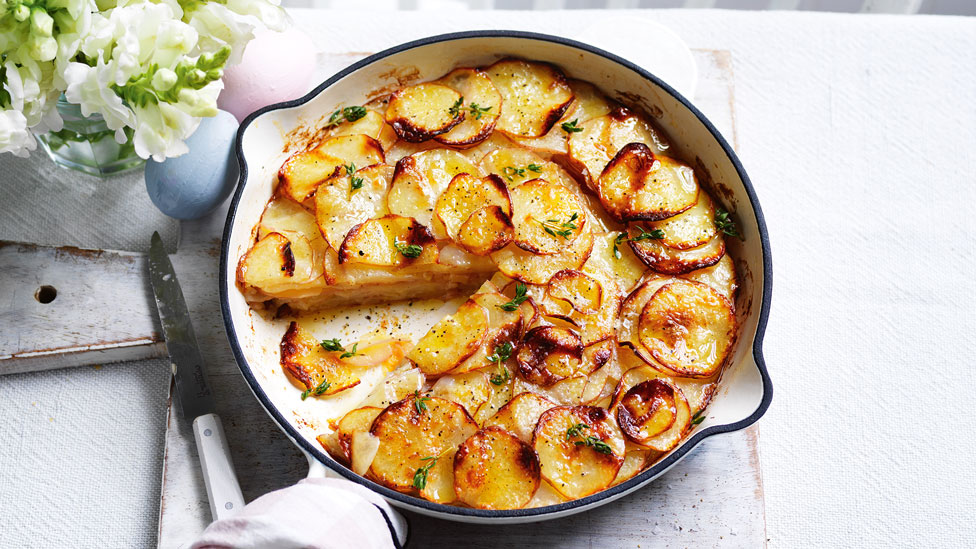 Potato, garlic and thyme torte cut into wedges