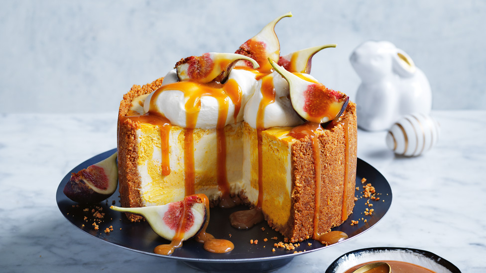Pumpkin pie cheesecake with figs, whipped cream and salted caramel