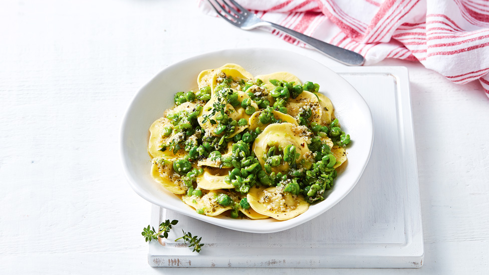 Pumpkin ravioli with peas and garlic butter sauce