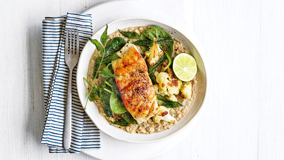 Spiced fish with cauliflower dhal and spinach leaves