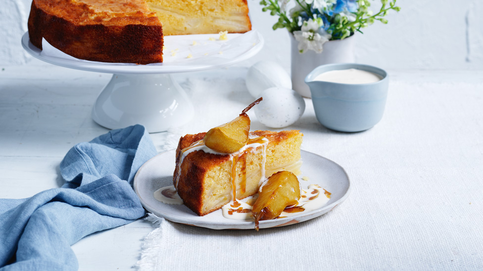 Sugar-crusted pear on top of brown a butter cake wedge