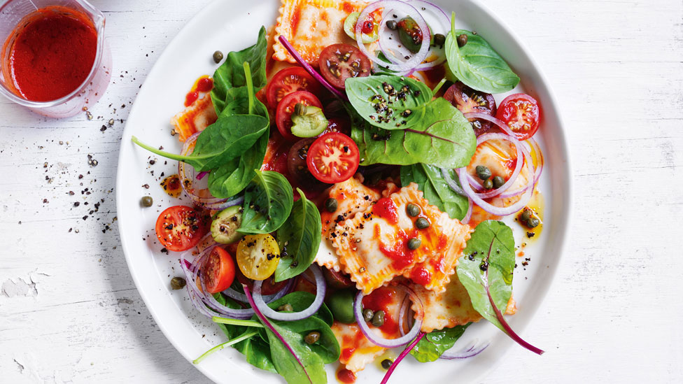 Ravioli pasta salad with gazpacho dressing and mixed tomatoes