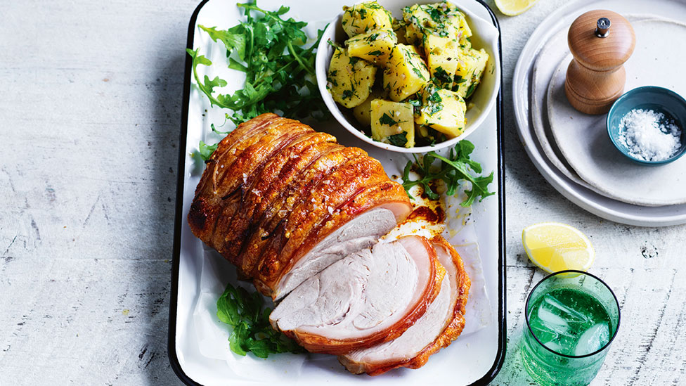 Roast pork leg with warm herbed potato salad 