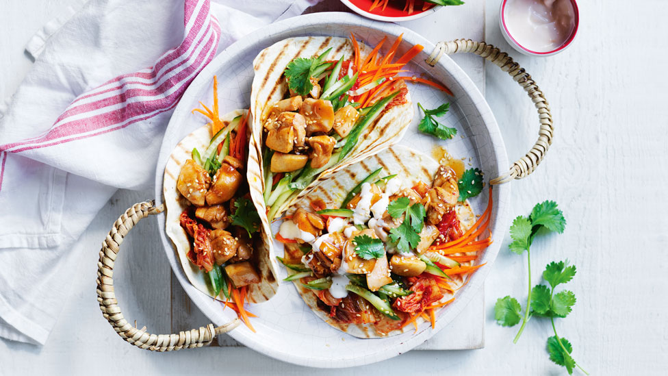 Four spicy Korean-style chicken tacos