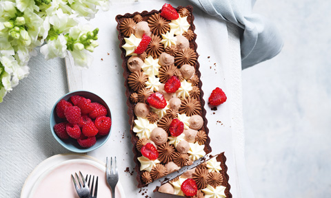 Chocolate truffle tart with mascarpone cream and raspberries