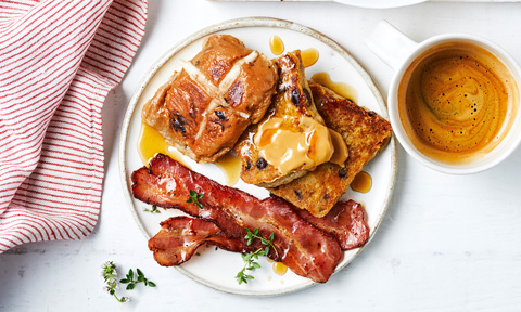 Three hot cross bun French toasts with maple bacon