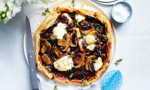 Mixed mushroom and onion galette with thyme sprigs
