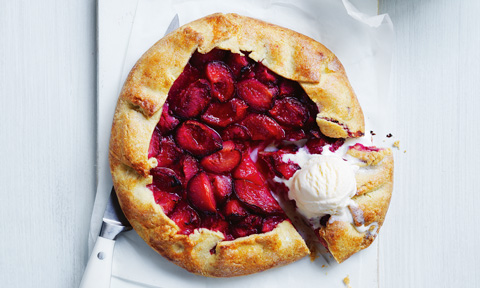 A pastry crosaa with plum and cream